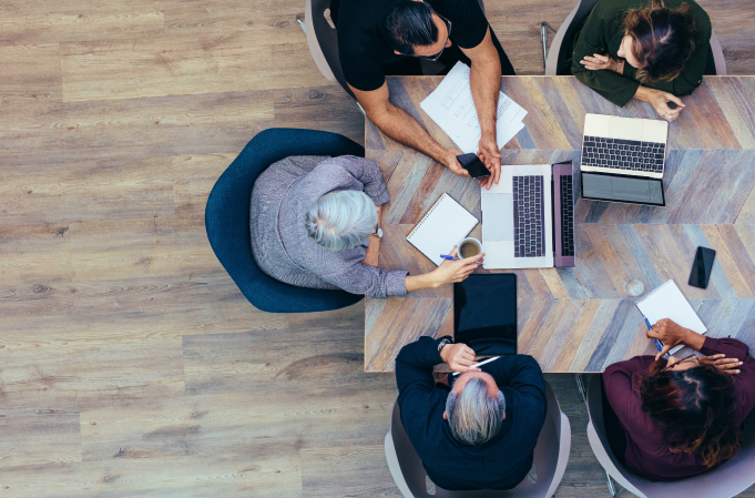 overhead shot of employees working together