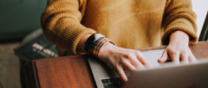 Hands typing on a keyboard