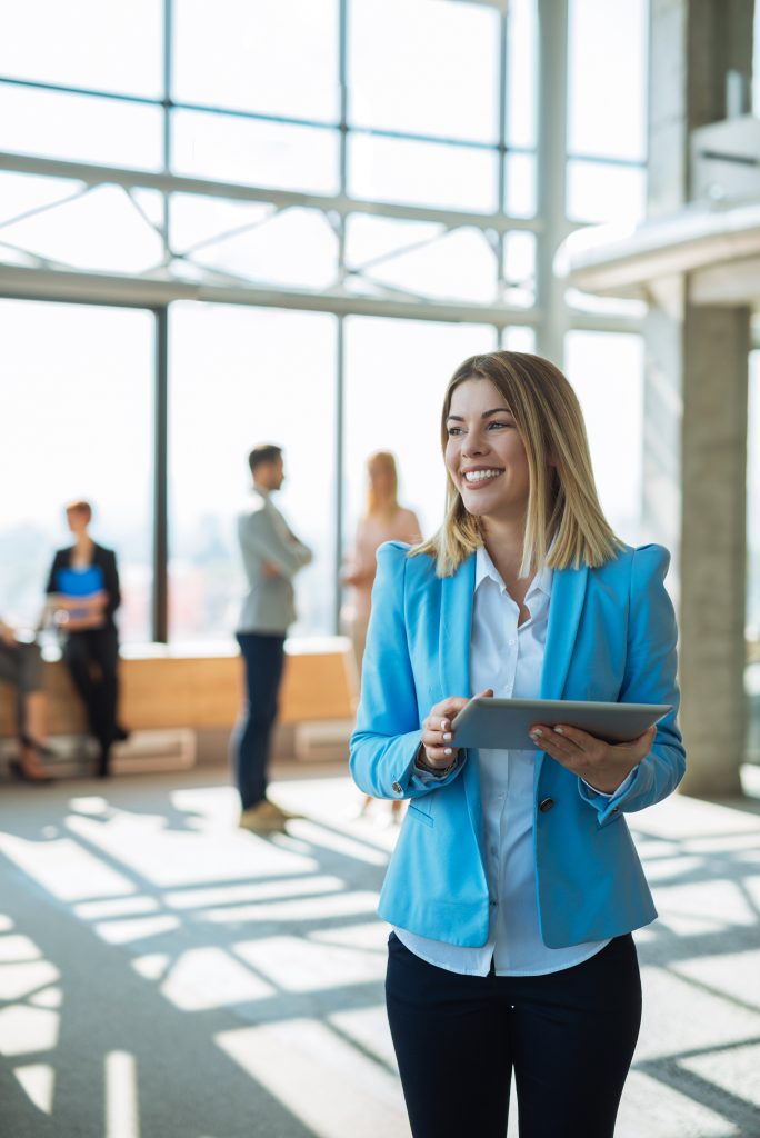 Businesswoman holding a tablet in an office