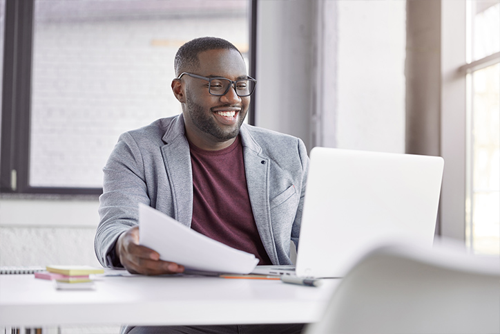 Person shopping during open enrollment on their laptop