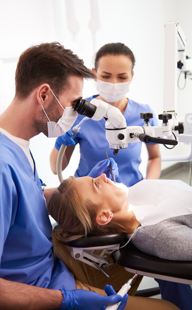 Dentists operating on dental patients