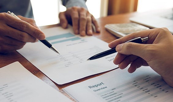 This is an image of people writing on pieces of paper that indicates report. It's an image to represent how busy our clients are and for visual representation of the content on the webpage.