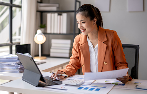 Happy female working at her desk